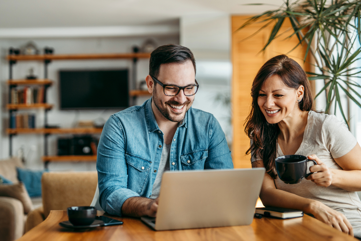 Couple on laptop during webinar meeting